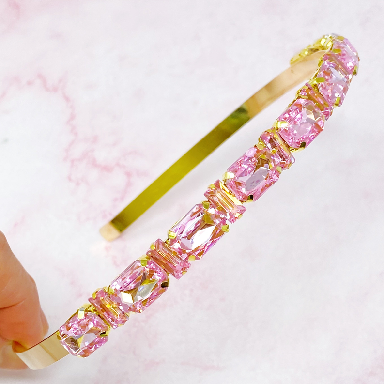 Pink rhinestone row headband with gold-tone backing