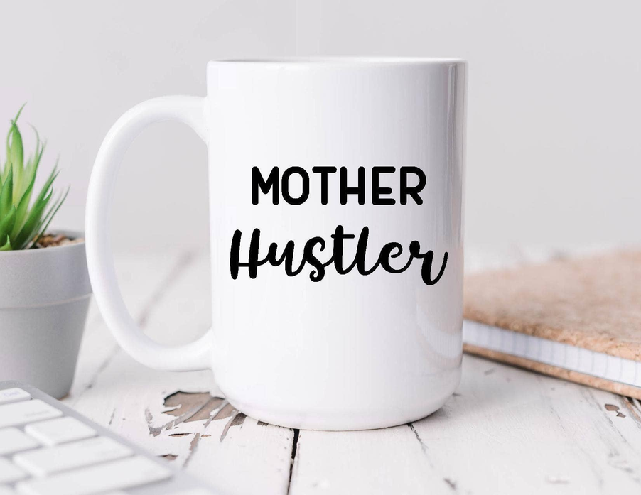 White coffee mug with 'Mother Hustler' black lettering, front view with handle