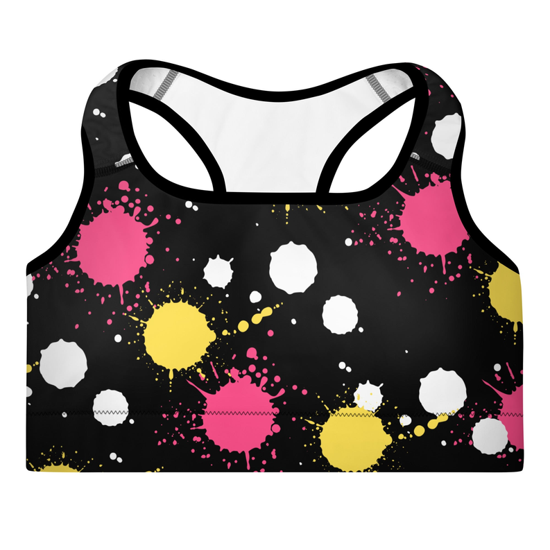 Front view padded sports bra with black splatter dots in pink, yellow, and white