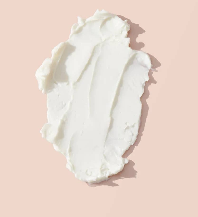 Thick white body cream swatch, smooth whipped texture