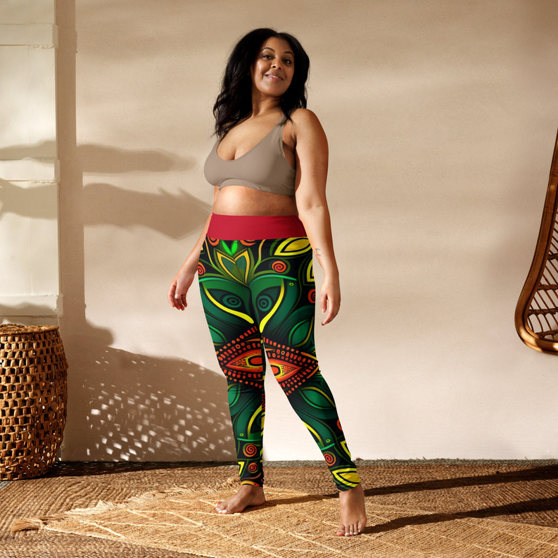 Green yoga leggings with red waistband and detailed yellow, orange, and black patterned design