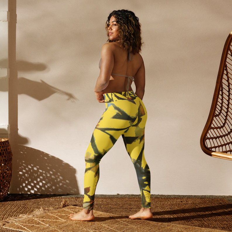 Back view: yellow tie-dye yoga leggings with abstract swirl pattern