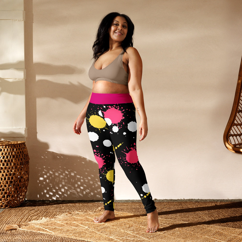 Yoga leggings with pink waistband, black splatter pattern, and yellow and white dots