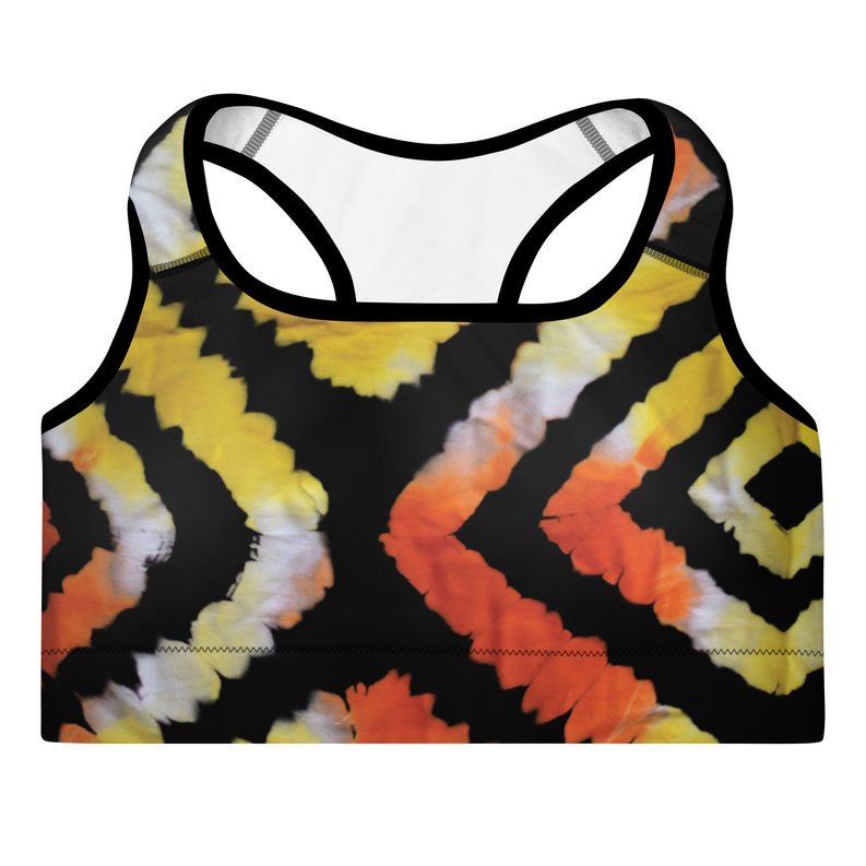 Padded sports bra in orange, yellow, and black tie-dye with racerback straps