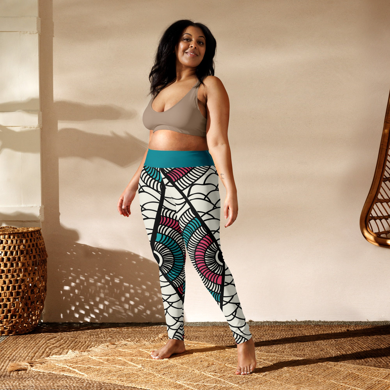 African print leggings with teal waistband and black, pink, teal swirl shapes on white
