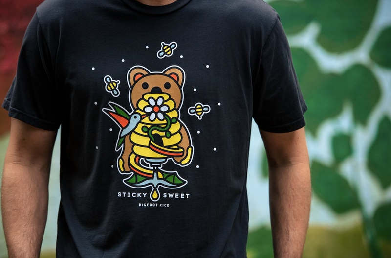 Black graphic T-shirt with bear and flowers cartoon print