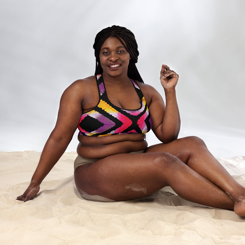 Padded sports bra with pink, yellow, and purple tie-dye on black, scoop neckline
