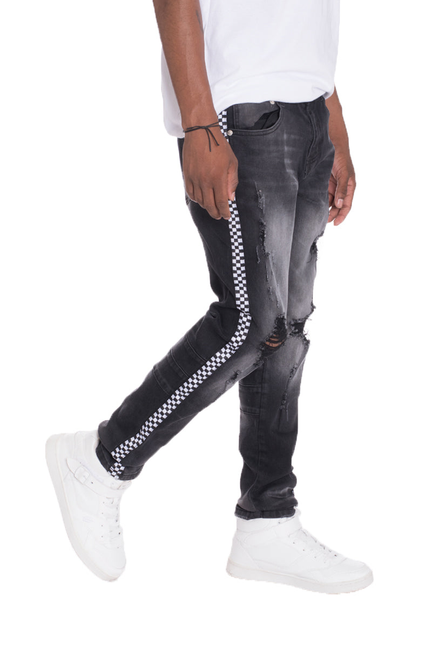 Black denim jeans with side checkered stripe and heavy knee distressing