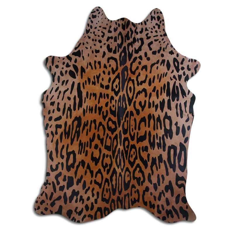 Jaguar-printed cowhide rug hide with dark spots on beige background, irregular shape