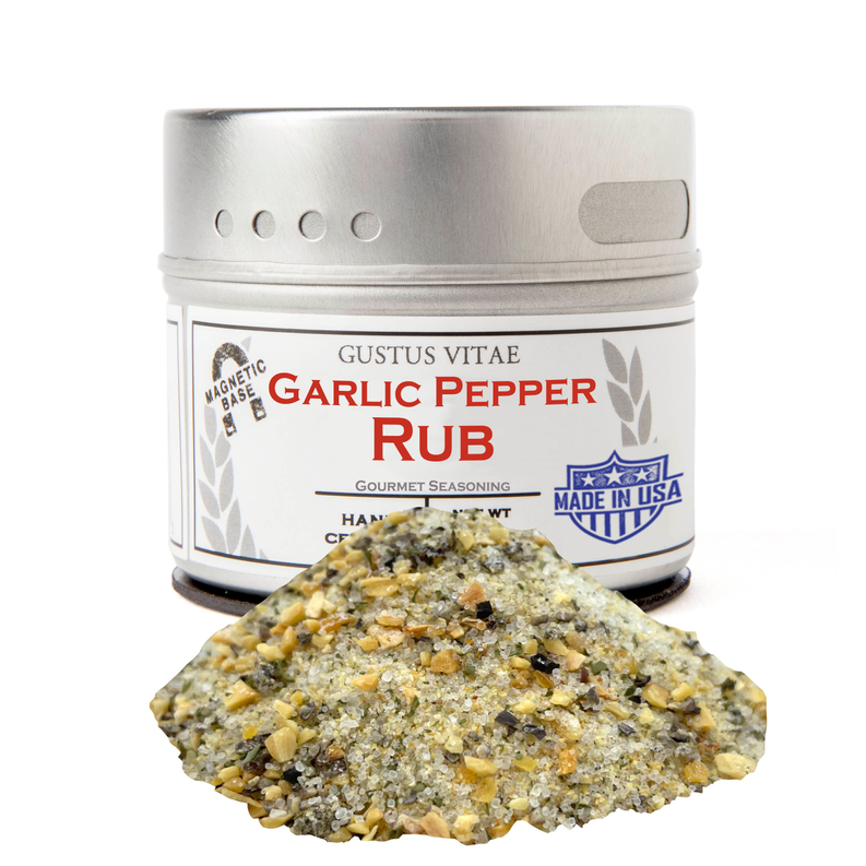 Garlic pepper rub seasoning jar with pale yellow spice blend heap