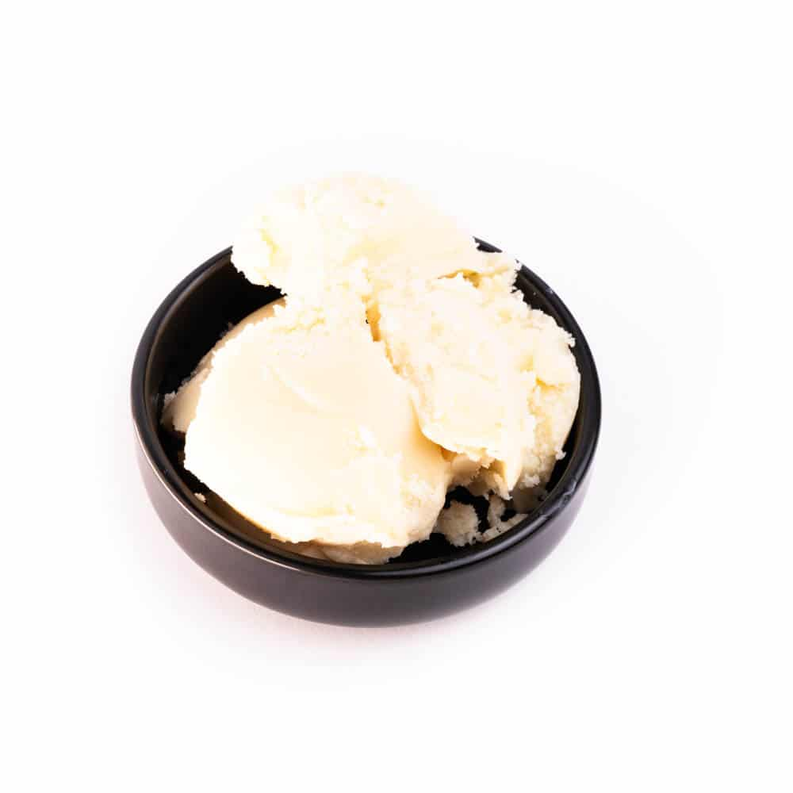 Cupuacu butter in a bowl, creamy pale yellow texture