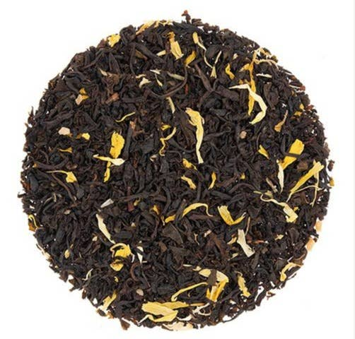 Loose black tea leaves with small yellow maple pieces