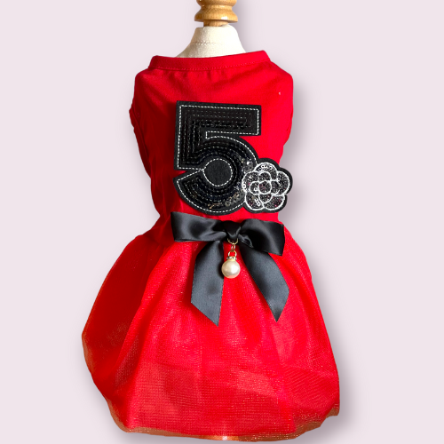 Red pet dress with embroidered '5' patch, black bow and dangling bead charm