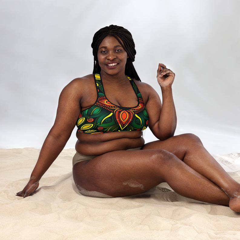 Padded sports bra with colorful geometric print and scoop neckline, model seated