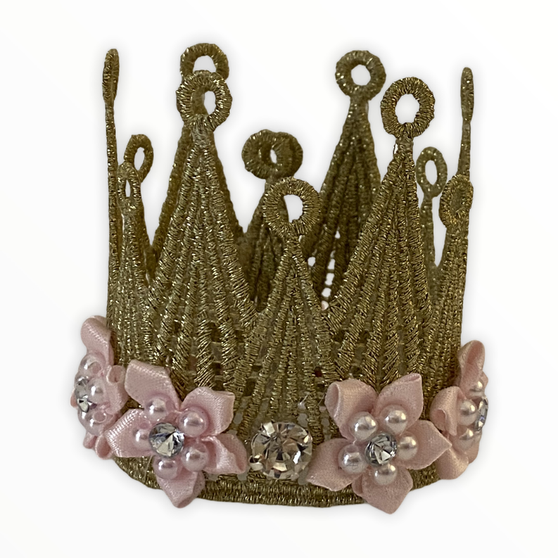 Gold beaded lace crown with tall loop design, pink floral trim, and crystal gems