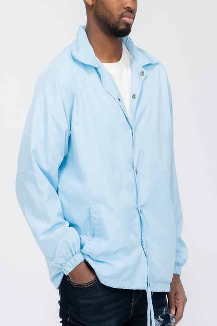 Men's sky blue coach jacket with stand collar and button front
