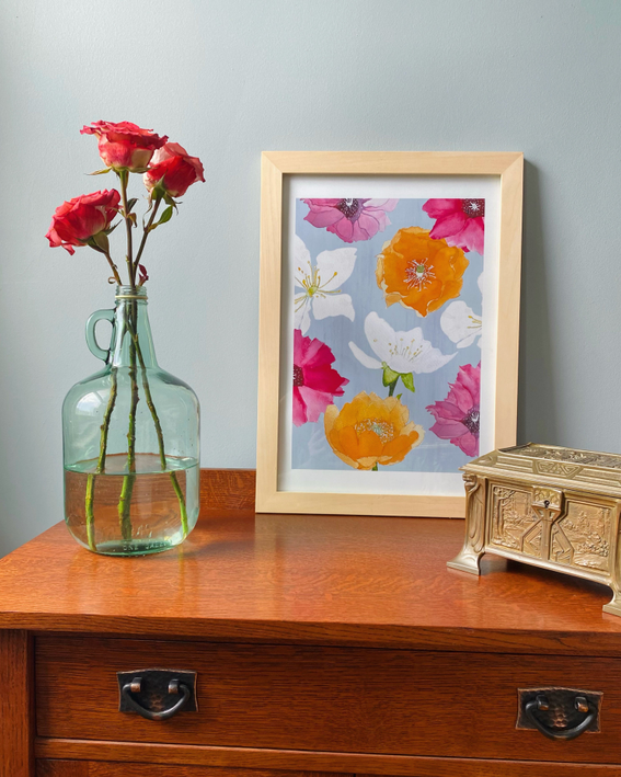 Framed floral art print with pink and orange flowers on gray background