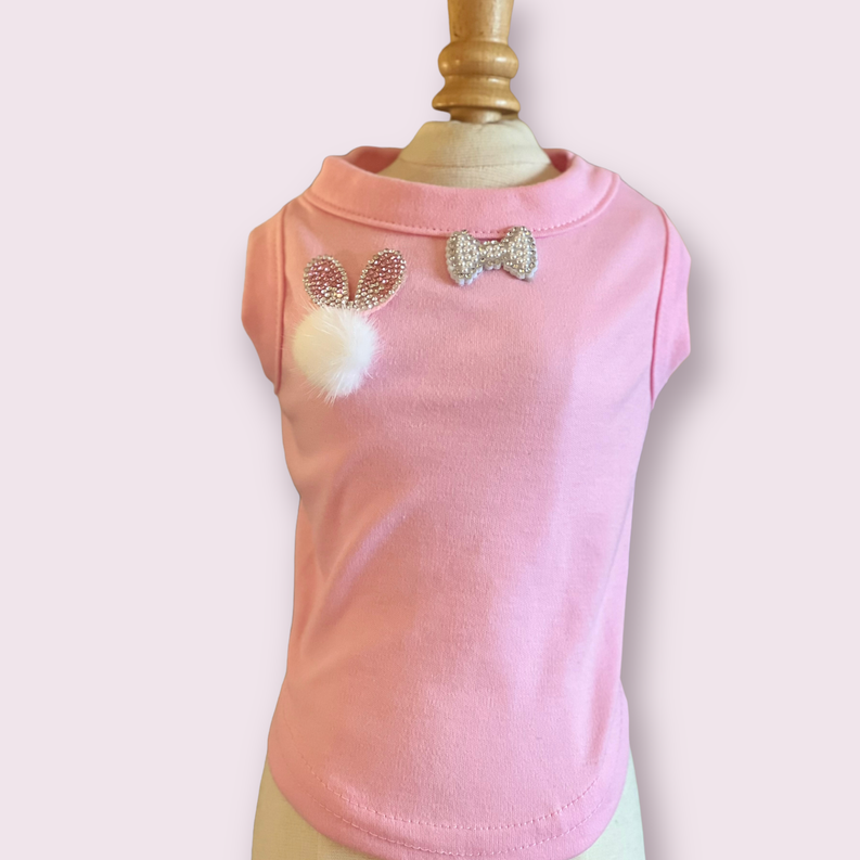 Peach-pink dog shirt with fuzzy bunny pom and rhinestone bow on chest