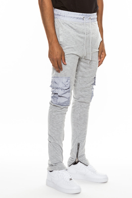 Grey lightweight slub jogger pants with drawstring waist and cargo-style pocket panels