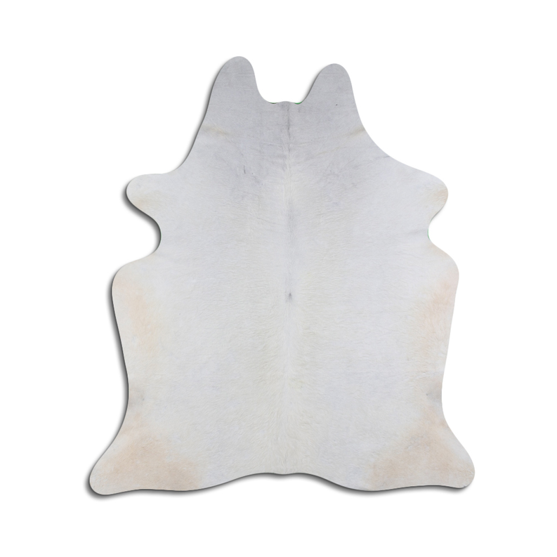 White and light gray natural cowhide rug with irregular patch pattern