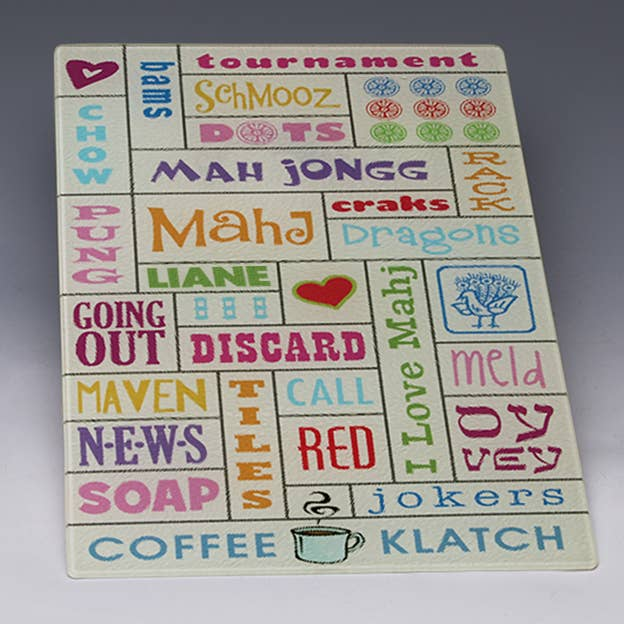 Mah Jongg cutting board with multicolor word-tile design and heart icons