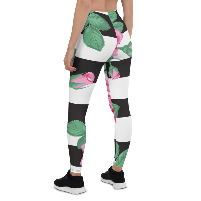 Floral print activewear leggings with black panels, pink roses, green leaves