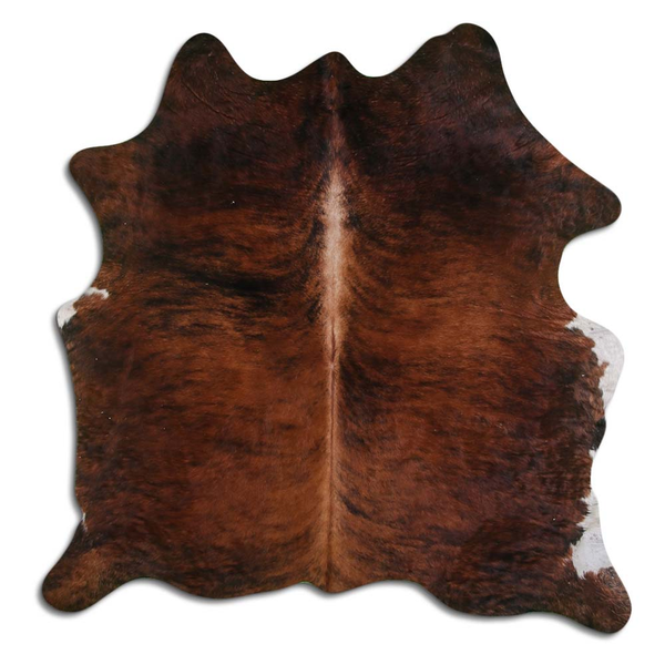 Medium brindle cowhide rug with natural hair, irregular patchwork hide shape