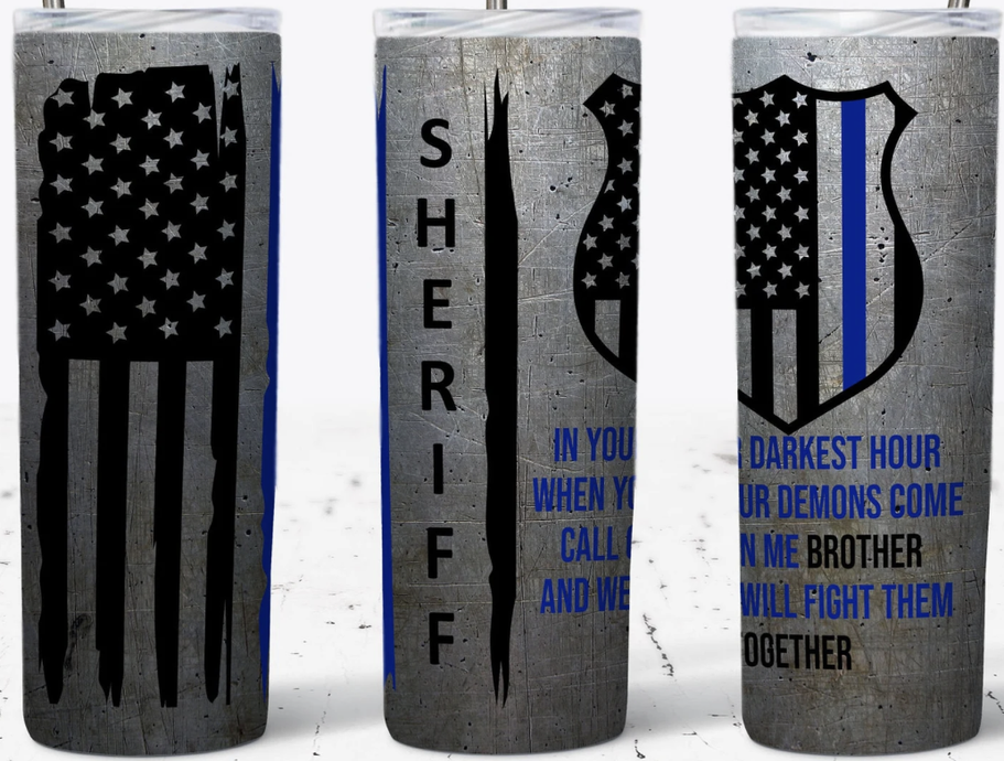 Stainless steel tumbler with patriotic stars and shield graphic in black and blue