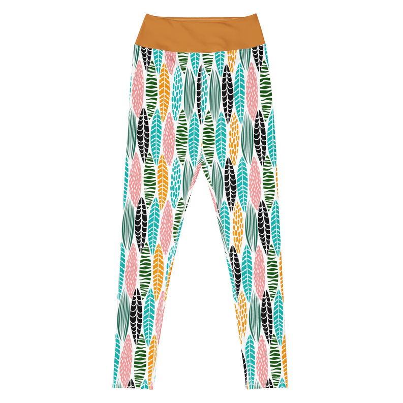 Patterned yoga leggings with multicolored leaf shapes on white, tan waistband