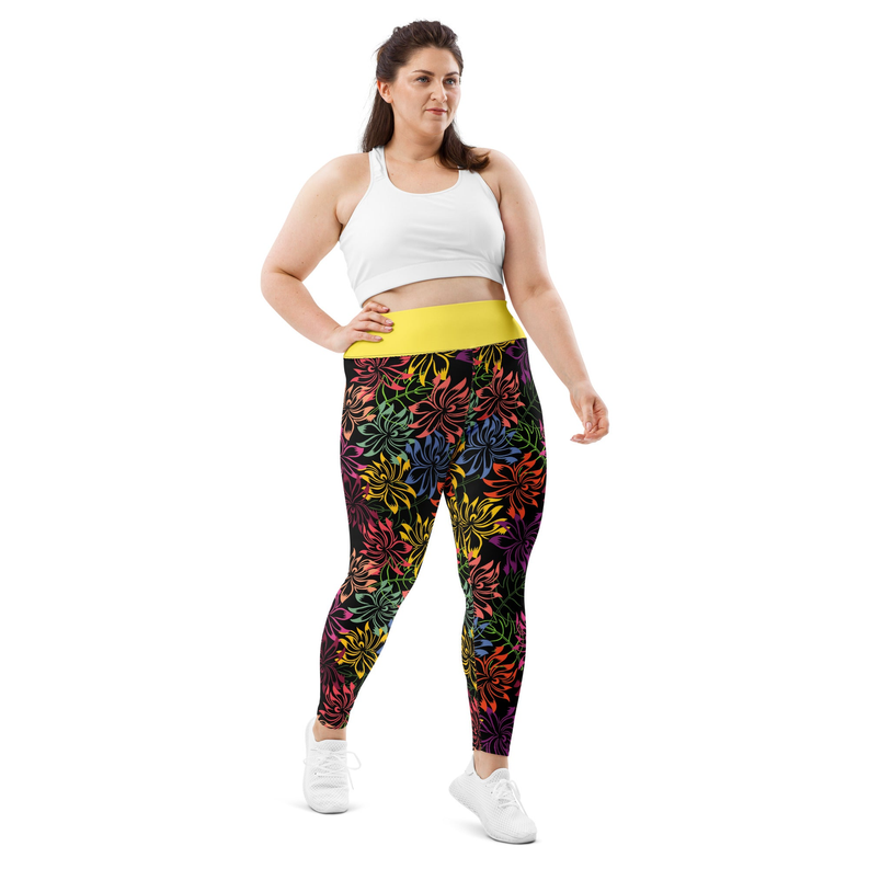 Floral leggings with multicolor leaf pattern over dark purple and a yellow waistband