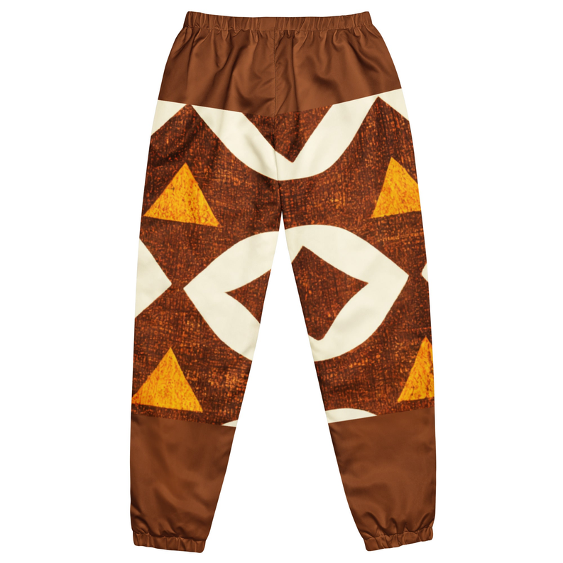 Brown unisex track pants with cream and orange geometric triangle print, elastic cuffs