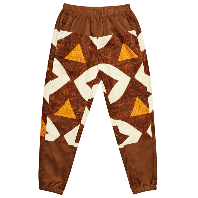 Brown unisex track pants with cream graphic triangle pattern, side pockets and elastic cuffs