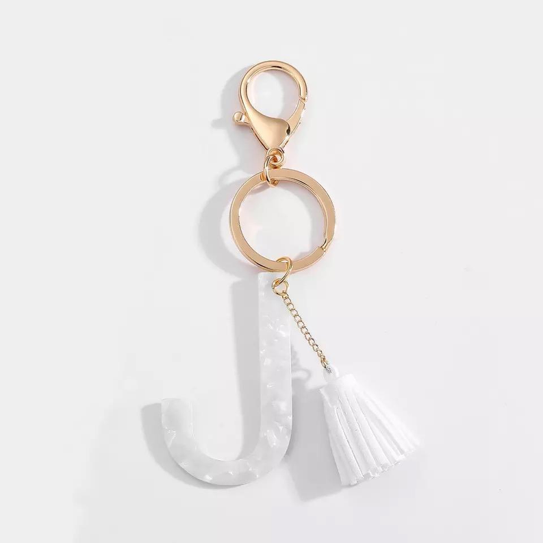 White initial J key chain with tassel and gold-tone double rings