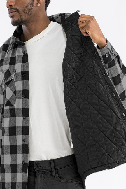 Quilted plaid flannel shirt in black/grey check, open front reveals black quilted lining