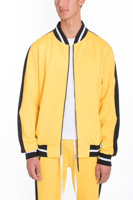 Yellow track jacket with black striped collar, front zip, and ribbed cuffs