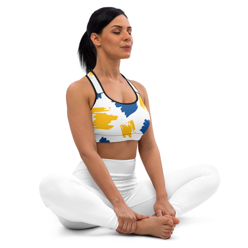 Padded sports bra with blue and yellow paint-splash print, scoop neckline, racerback