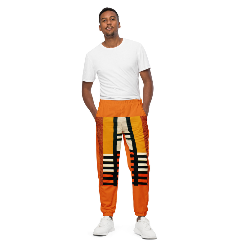 Orange track pants with black-and-cream geometric side print, elastic waistband