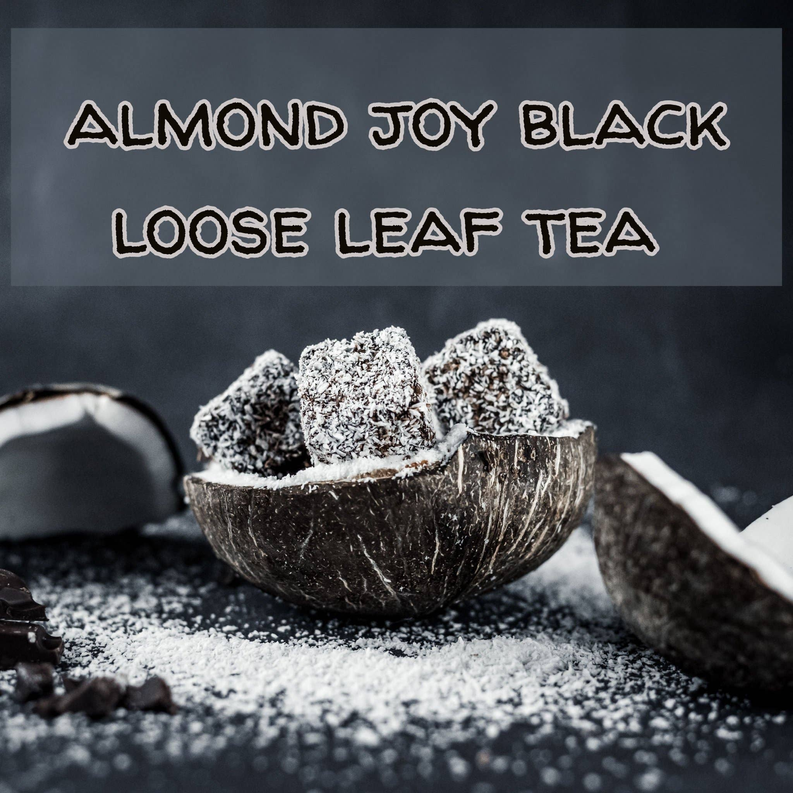 Loose black tea leaves in a bowl with dusted cacao pieces