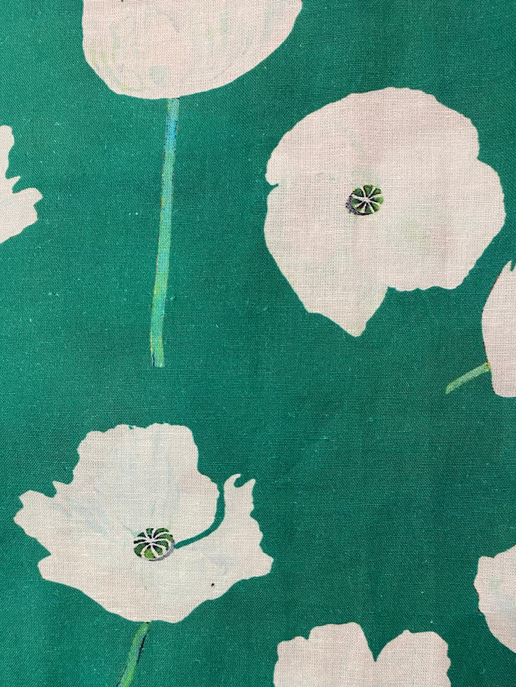 Emerald green fabric with white flower motifs and small stem details