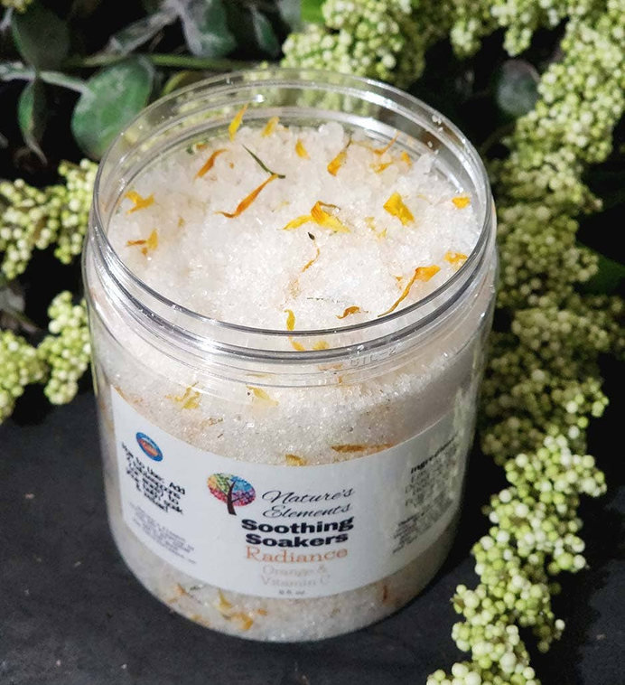 Bath soak jar with white crystals and yellow flower petals, Relax scent, clear screw-top