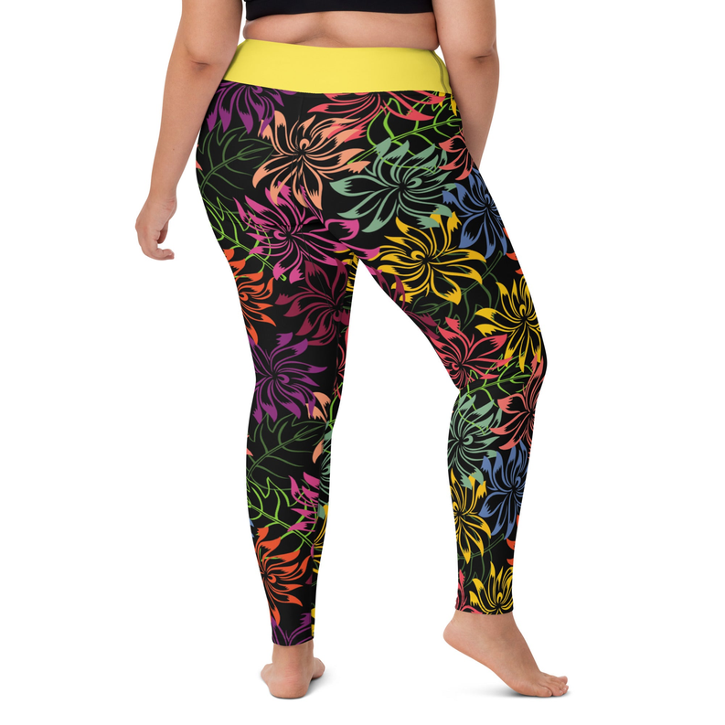 Floral yoga leggings with yellow waistband; multicolor flower print on dark fabric, full length.