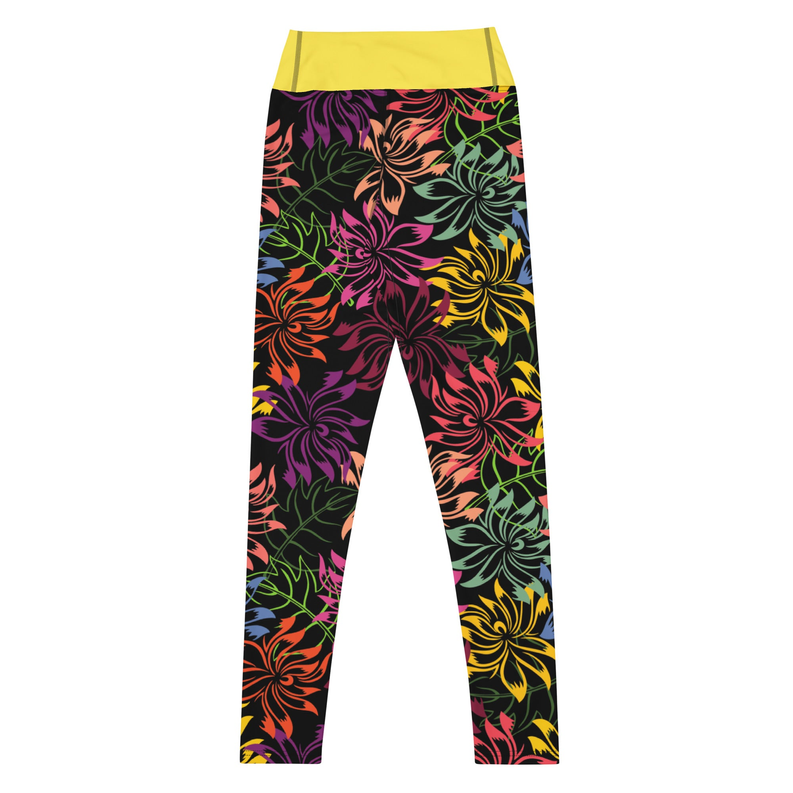 Floral yoga leggings with yellow waistband; dark fabric with colorful floral pattern, flat lay.