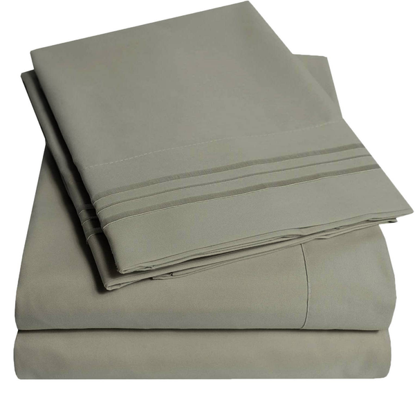 Soft sheet set in sage gray: folded fitted and flat sheets with stitched bands.