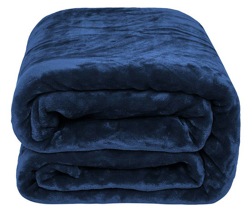 Navy plush flannel throw blanket, neatly stacked folds with soft sheen