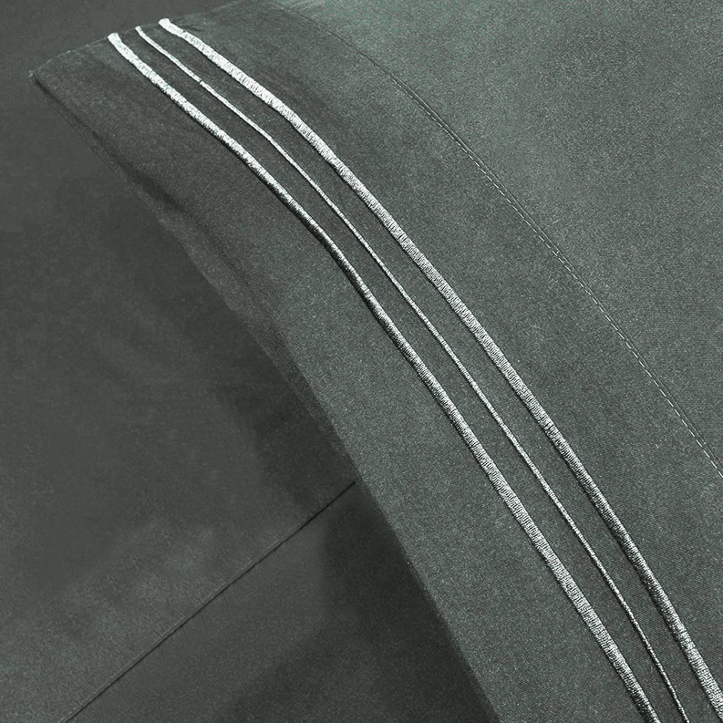 Dark grey flat sheet detail with triple embroidered stripe trim