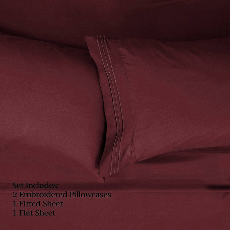 Burgundy sheet set with double-stitched seam detail along the edge