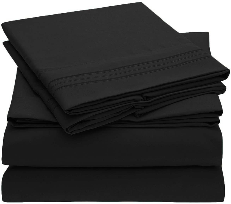 Black sheet set stack of neatly folded sheets
