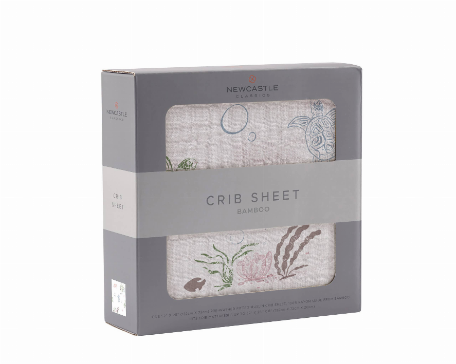 Crib sheet box with turtles and sea-life illustrations on “Bamboo” style label