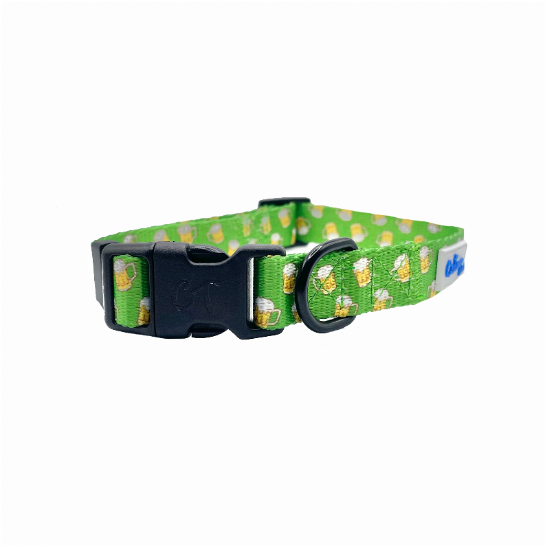 Green dog collar with dog treat pattern, black clasp and metal D-ring