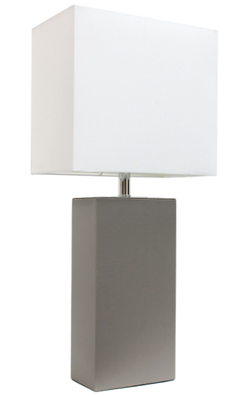 Modern table lamp with white fabric shade and rectangular gray leather base